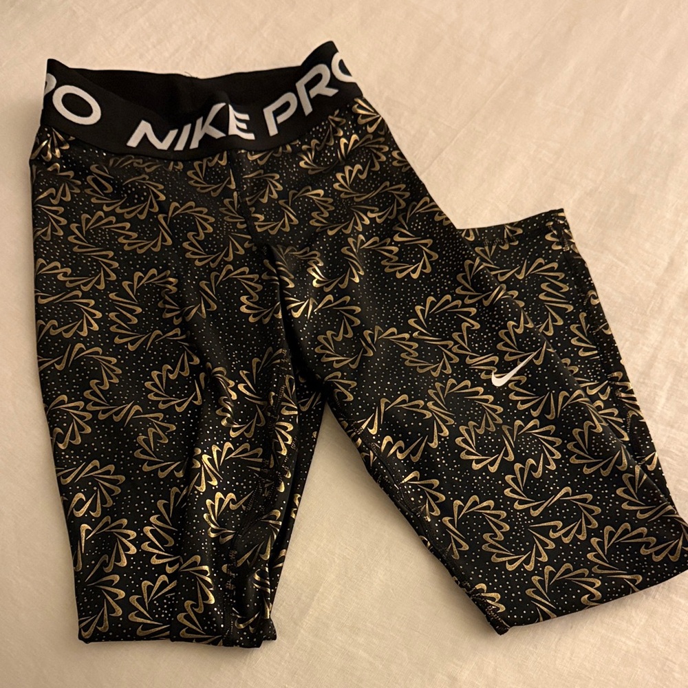 Nike XS black and gold leggings